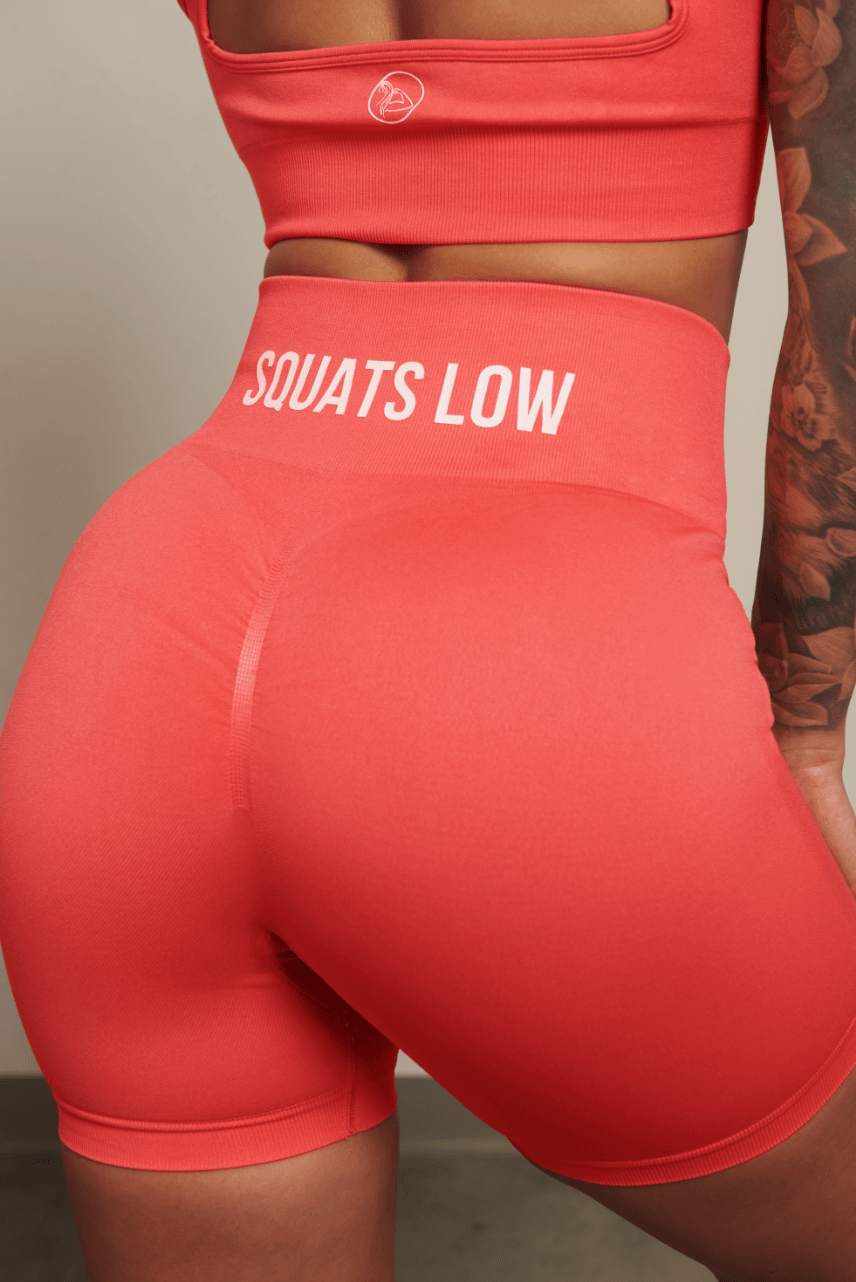 Keep your Standards High & Squats Low & stand the f*ck out out in the weight room in our Coral Squats Low Seamless Scrunch Shorts